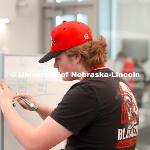 Volunteer, Nate Lind from Omaha, NE helping track scores. 2024 VEX Robotics Outreach Tournament hosted in Kiewit Hall. February 10, 2024. Photo by Taryn Hamill for University Communication and Marketing.