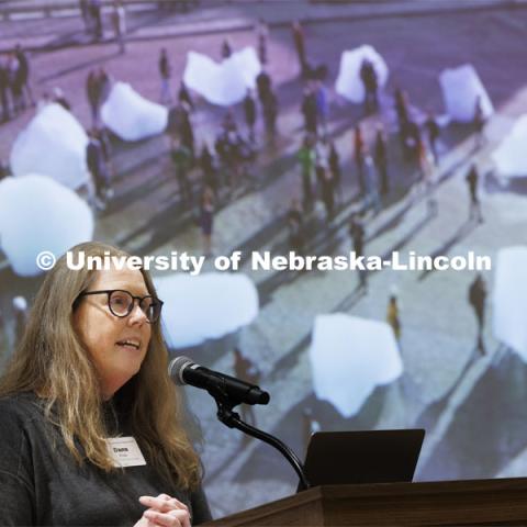 Dana Fritz, Professor of School of Art, Art History and Design describes how artwork can bring home climate change and make it more memorable. Behind her is Ice Watch, 2014 by the Swedish artist Olafur Eliasson. Climate Resilient Communities Symposium. Nebraska East Union. February 27, 2024. Photo by Craig Chandler / University Communication and Marketing.
