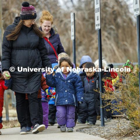 Mollie Von Kampen leads the children on a field trip. Students in the Ruth Staples Child Development Lab go on a field trip to the Nebraska East Union and a walk around campus. March 1, 2024. Photo by Craig Chandler / University Communication and Marketing.
