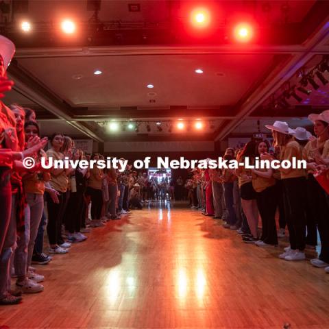 University of Nebraska-Lincoln students make a path to usher in the miracle families attending Dance Marathon. University of Nebraska–Lincoln students raised $83,702.24 during the annual HuskerThon. Also known as Dance Marathon, the event is part of a nationwide fundraiser supporting Children’s Miracle Network Hospitals. The annual event, which launched in 2006, is the largest student philanthropic event on campus. The mission of the event encourages participants to, “dance for those who can’t.” All funds collected by the Huskers benefit the Children’s Hospital and Medical Center in Omaha. March 2, 2024. Photo by Kirk Rangel.
