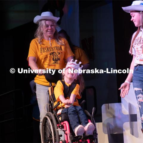 A miracle child is wheeled into the Dance Marathon. HuskerThon Dance Marathon 2024. University of Nebraska–Lincoln students raised $83,702.24 during the annual HuskerThon. Also known as Dance Marathon, the event is part of a nationwide fundraiser supporting Children’s Miracle Network Hospitals. The annual event, which launched in 2006, is the largest student philanthropic event on campus. The mission of the event encourages participants to, “dance for those who can’t.” All funds collected by the Huskers benefit the Children’s Hospital and Medical Center in Omaha. March 2, 2024. Photo by Kirk Rangel.