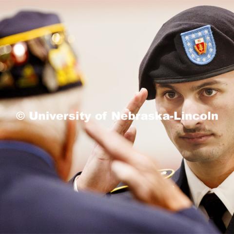 Cadet Lawrence Miller salutes after receiving his American Legion Post 3 General Scholastic Excellence Award. Joint Service Chancellor’s Review of the ROTC Cadets in Cook Pavilion. April 18, 2024. Photo by Craig Chandler / University Communication and Marketing.